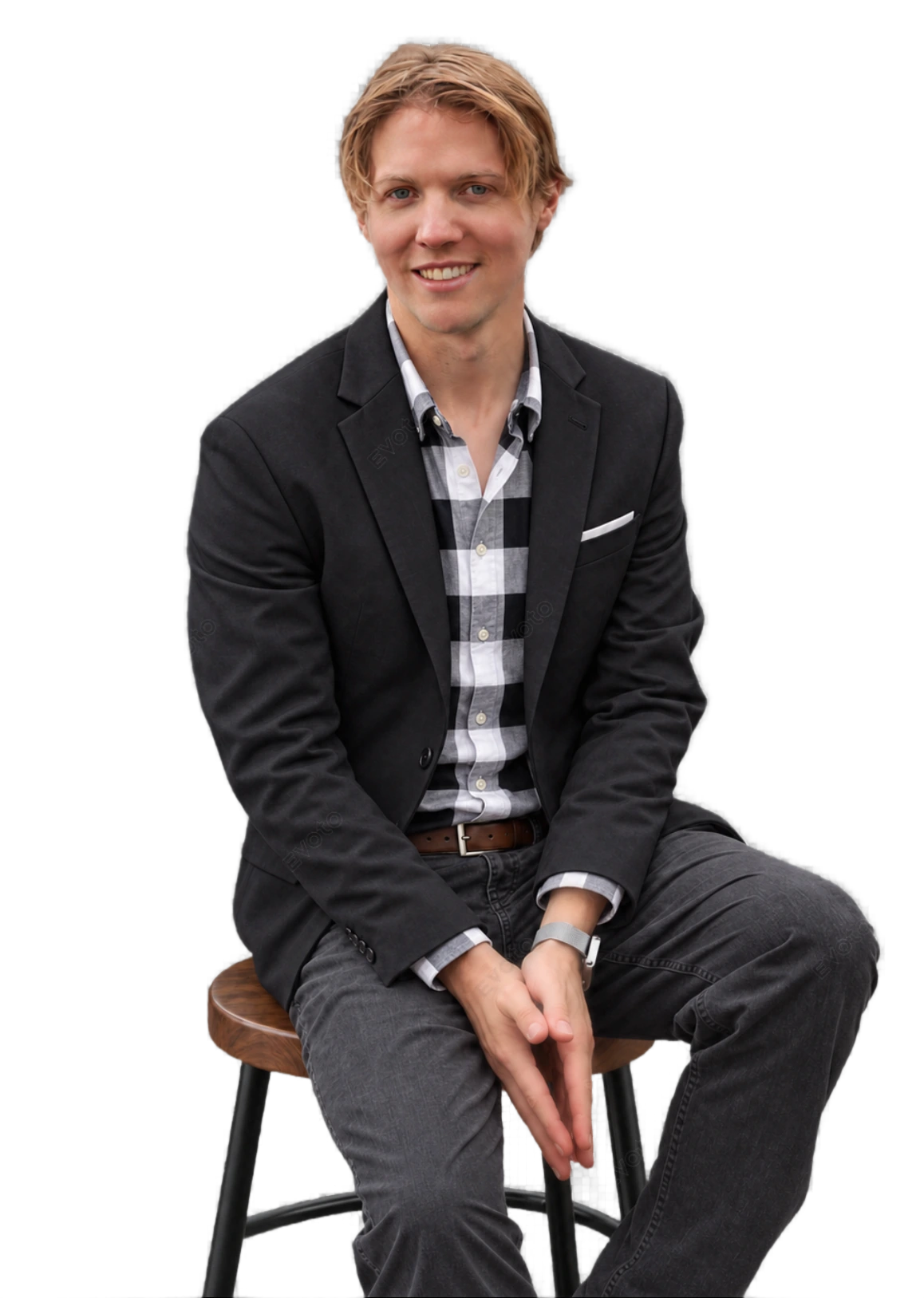 Kyle Kelly seated on a wooden table
